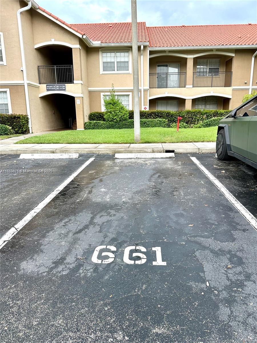231 Southwest 116th Avenue, Unit 19108 Pembroke Pines, FL 33025 - Photo 2 of 56 a view of outdoor space and yard