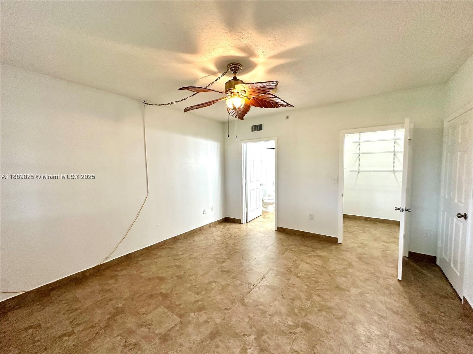 231 Southwest 116th Avenue, Unit 19108 Pembroke Pines, FL 33025 - Photo 21 of 56 a view of an empty room