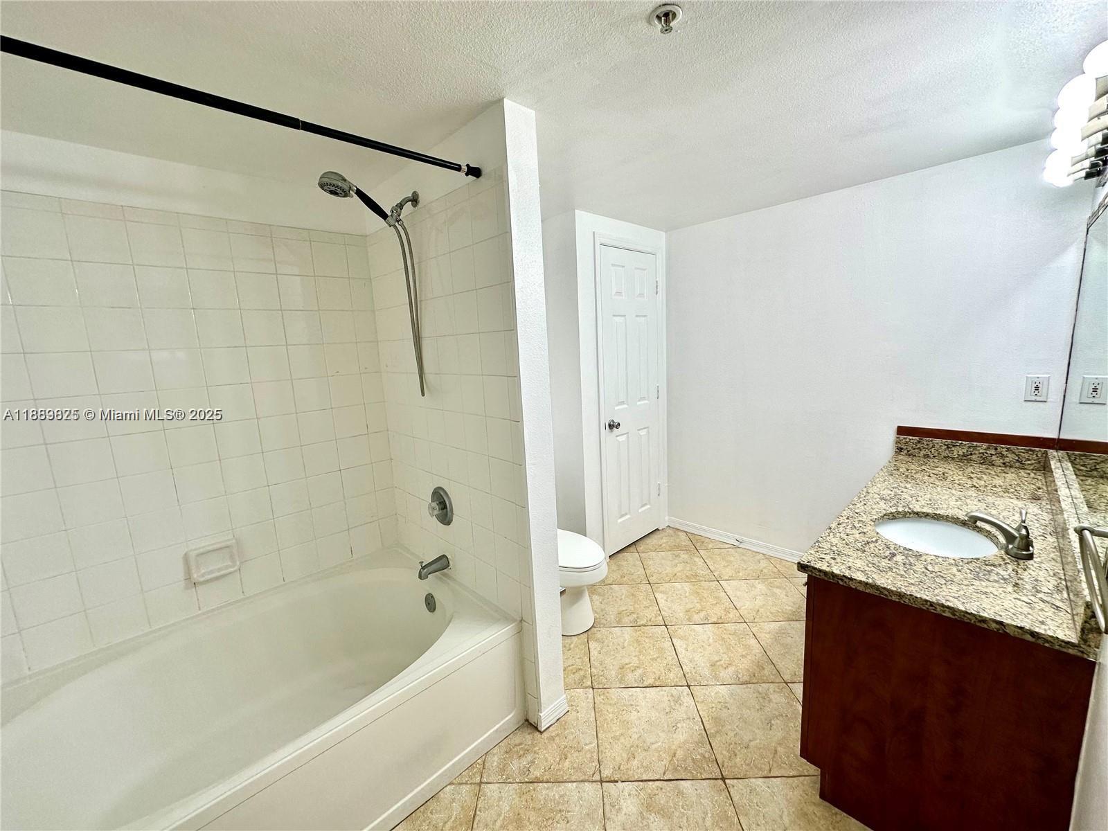 231 Southwest 116th Avenue, Unit 19108 Pembroke Pines, FL 33025 - Photo 28 of 56 a bathroom with a tub shower and sink