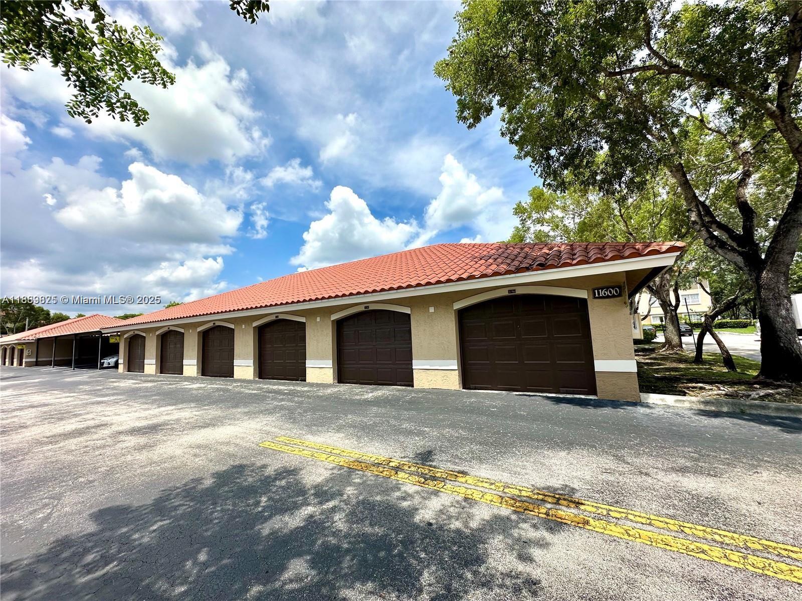 231 Southwest 116th Avenue, Unit 19108 Pembroke Pines, FL 33025 - Photo 3 of 56 a view of a white house with a outdoor space