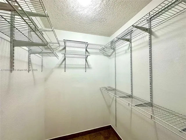 a view of a house with swimming pool and sitting area