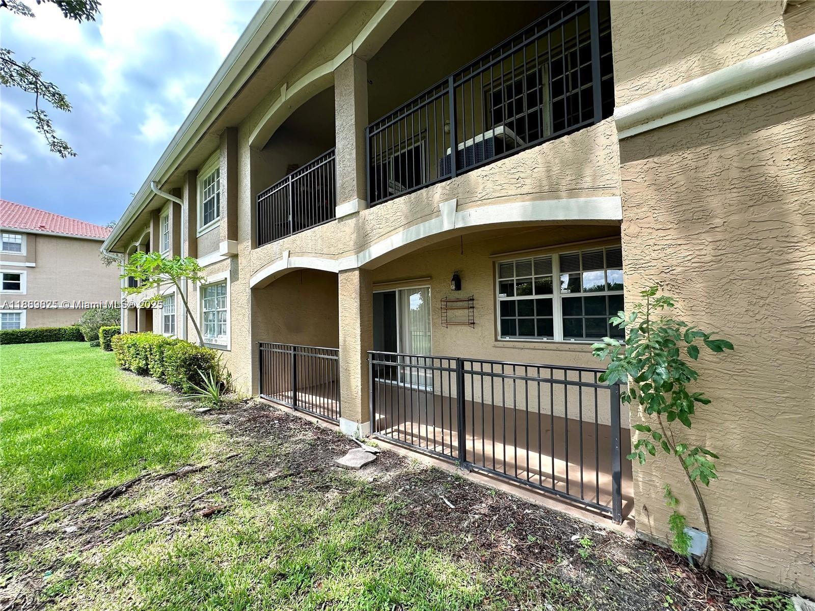 231 Southwest 116th Avenue, Unit 19108 Pembroke Pines, FL 33025 - Photo 33 of 56 a view of house with backyard porch and entertaining space