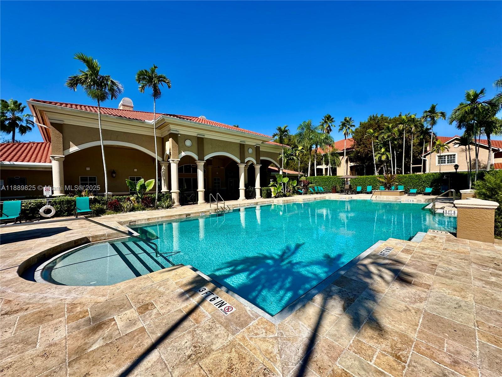 231 Southwest 116th Avenue, Unit 19108 Pembroke Pines, FL 33025 - Photo 38 of 56 a view of a house with a swimming pool