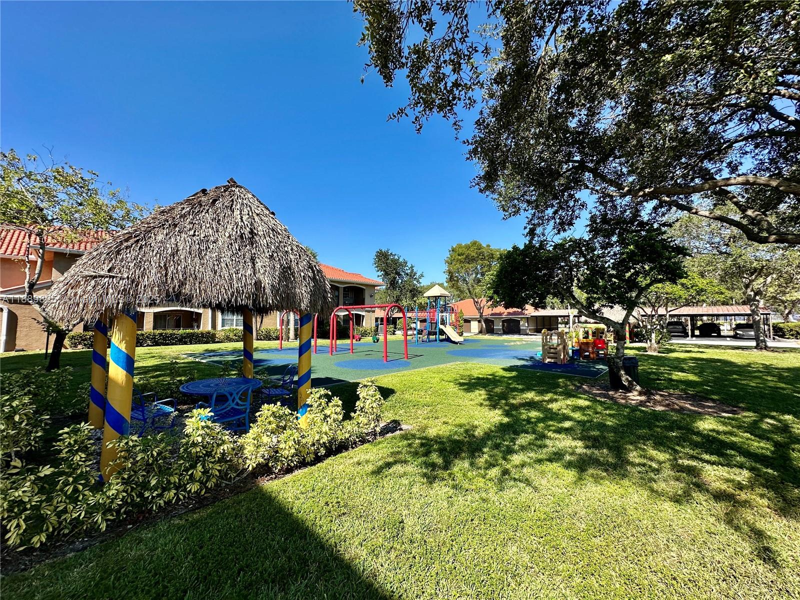 231 Southwest 116th Avenue, Unit 19108 Pembroke Pines, FL 33025 - Photo 39 of 56 a garden view with a seating space