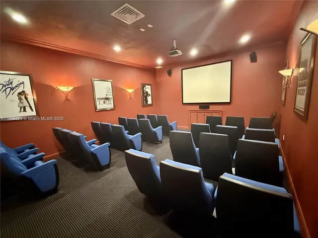 a dining room with furniture and a floor to ceiling window