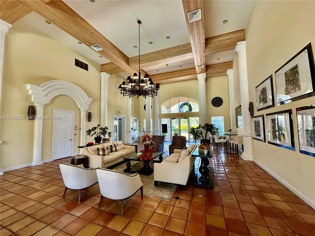 a view of a chairs and table in a backyard