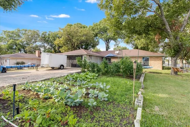 a house view with a garden space