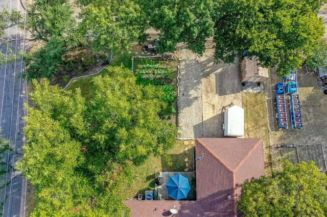 an aerial view of residential house with outdoor space