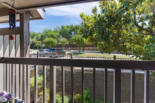 a view of a balcony with wooden floor