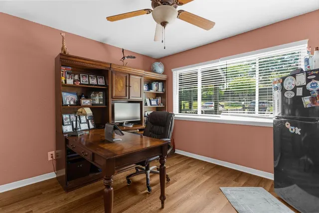 a workspace with furniture and a window