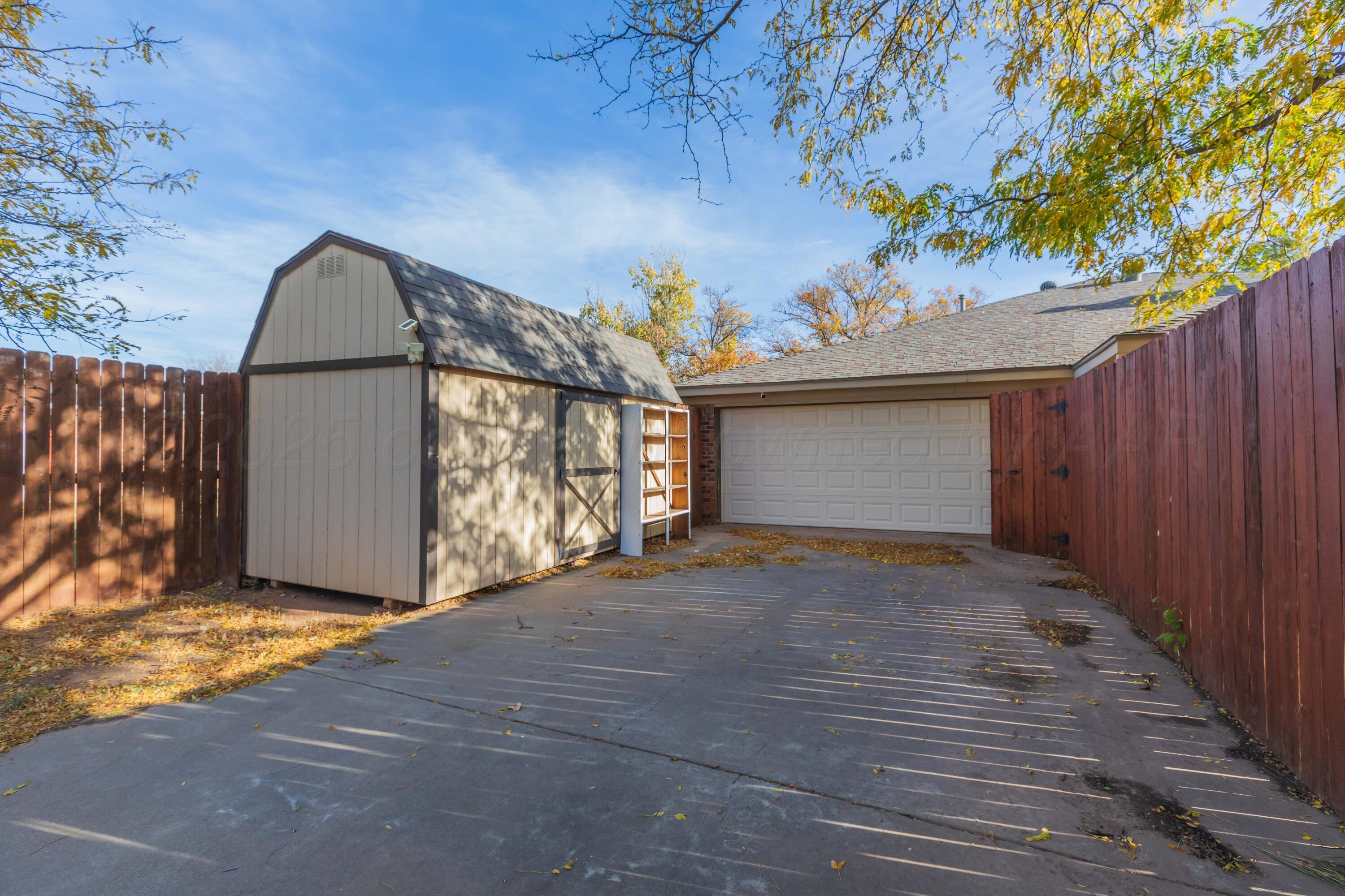 7805 Farrell Drive Amarillo, TX 79121 - Photo 18 of 20 a view of backyard and tree