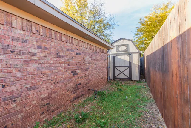 a view of a back yard of the house