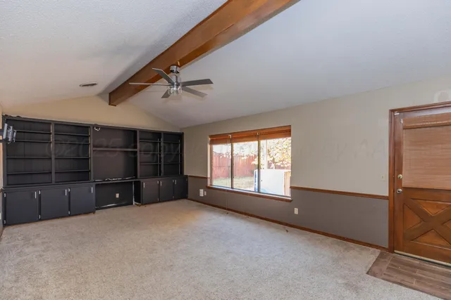 a view of a livingroom with furniture and chandelier