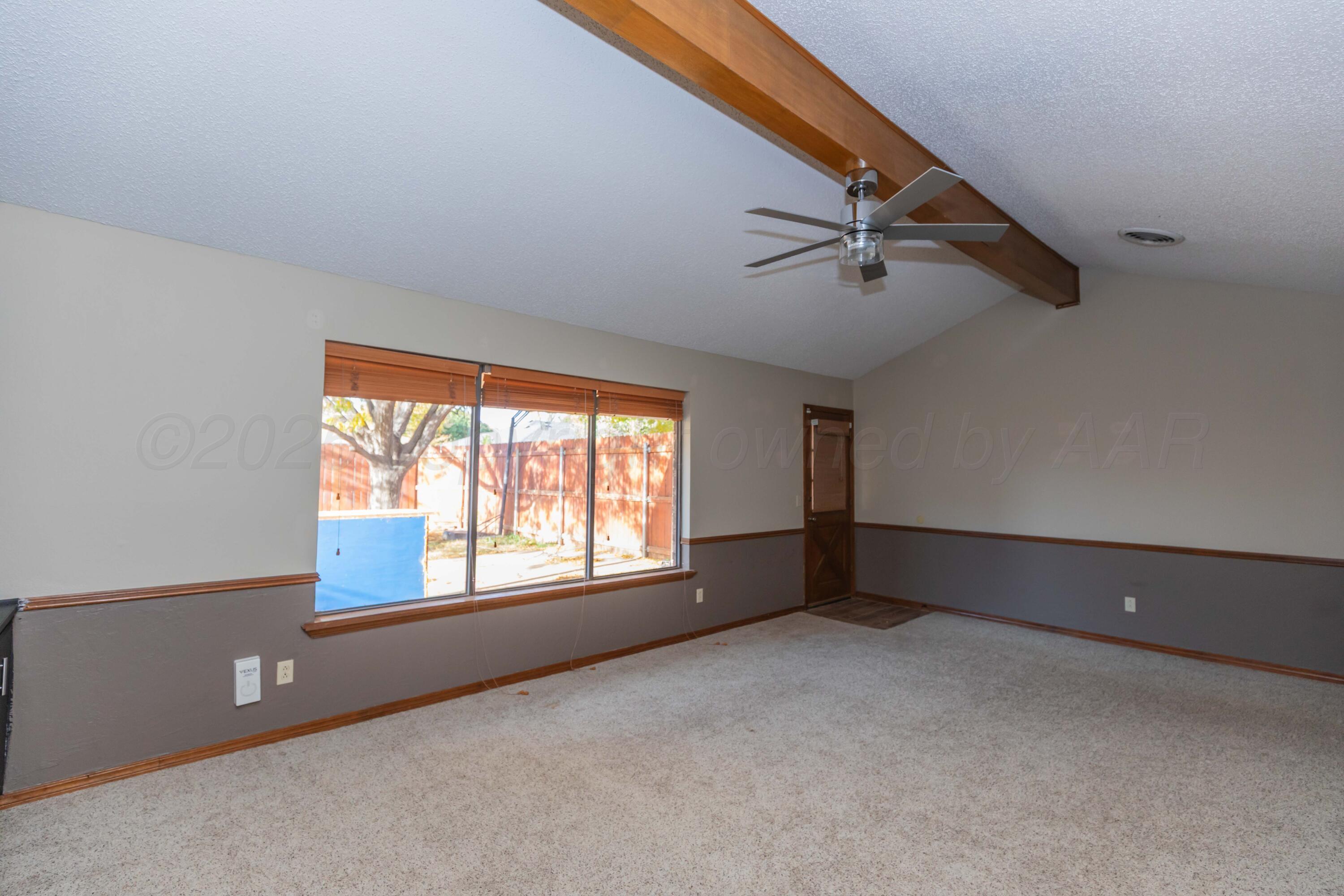 7805 Farrell Drive Amarillo, TX 79121 - Photo 9 of 20 an empty room with windows