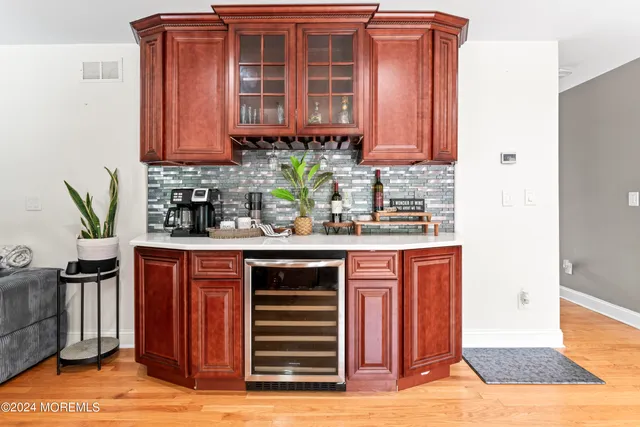 a kitchen with stainless steel appliances granite countertop a sink and cabinets
