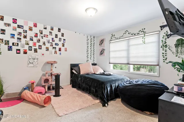 a bed room with a bed and a window