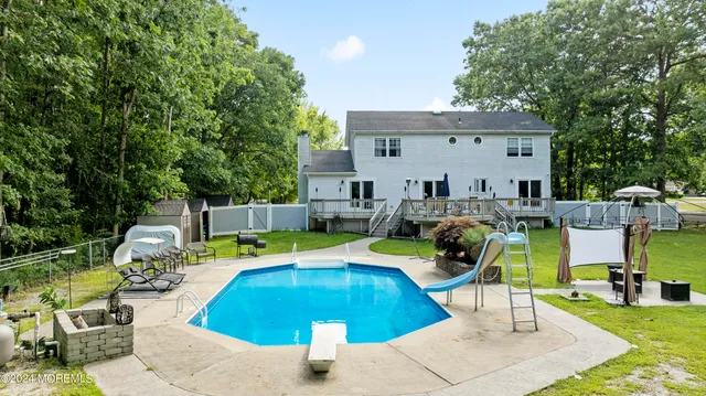 a view of a swimming pool with a patio