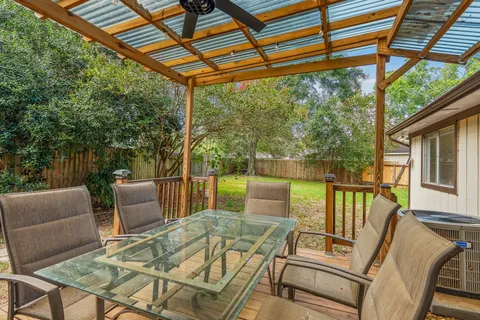 a view of a patio with furniture