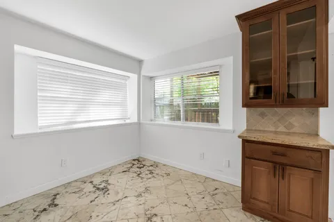 a view of a kitchen and a window