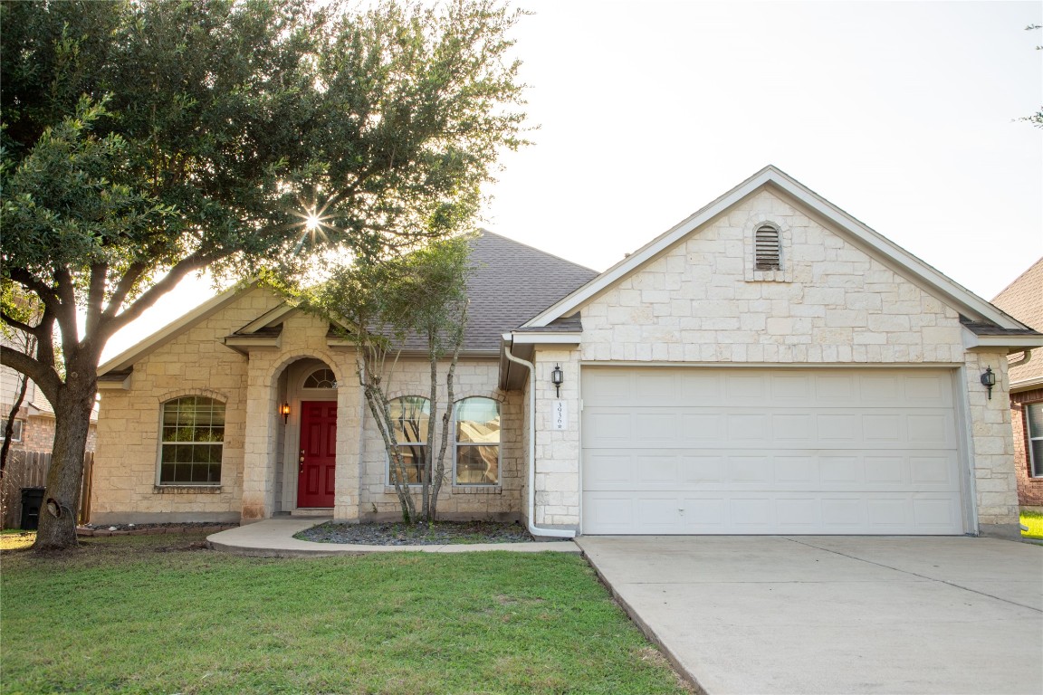 3936 Links Lane Round Rock, TX 78664 - Photo 1 of 40 a front view of a house with a yard and garage