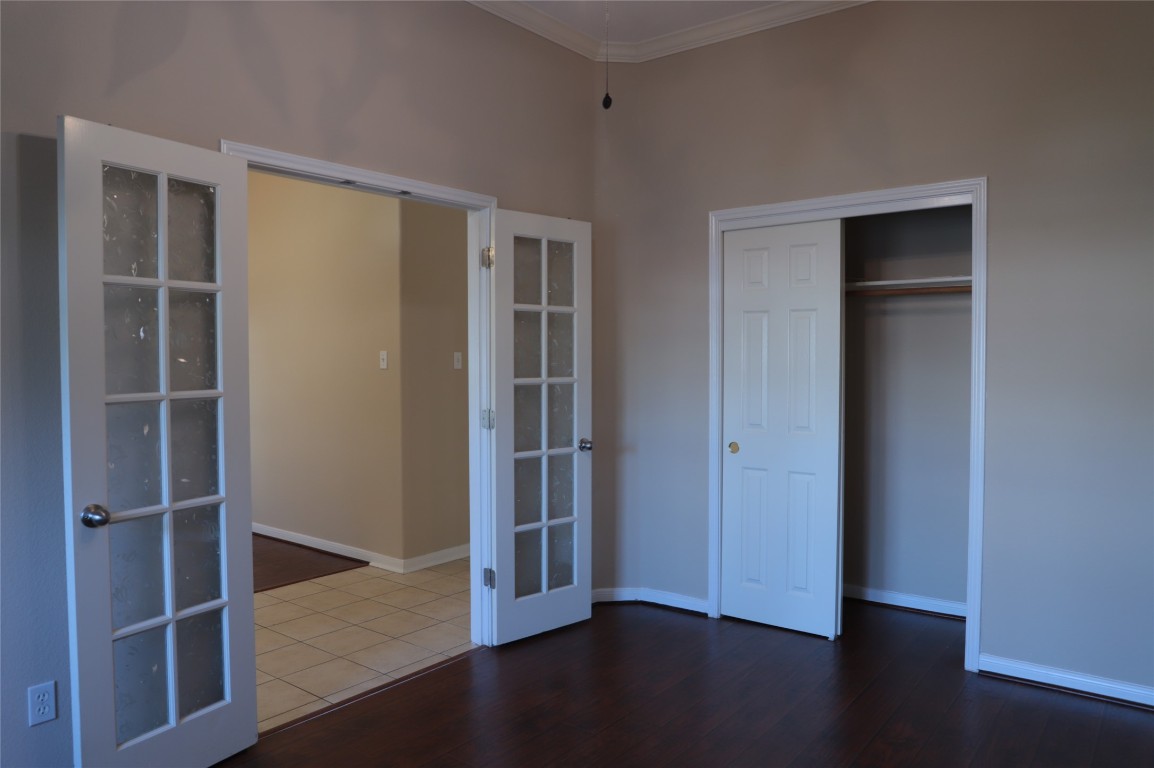 3936 Links Lane Round Rock, TX 78664 - Photo 14 of 40 an empty room with wooden floor closet and windows