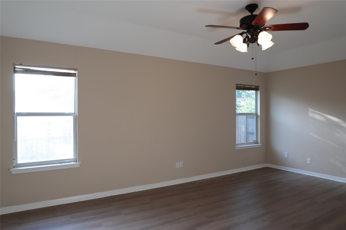 3936 Links Lane Round Rock, TX 78664 - Photo 21 of 40 a view of a room with wooden floor and a window