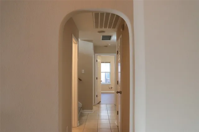 a view of a bathroom from a hallway