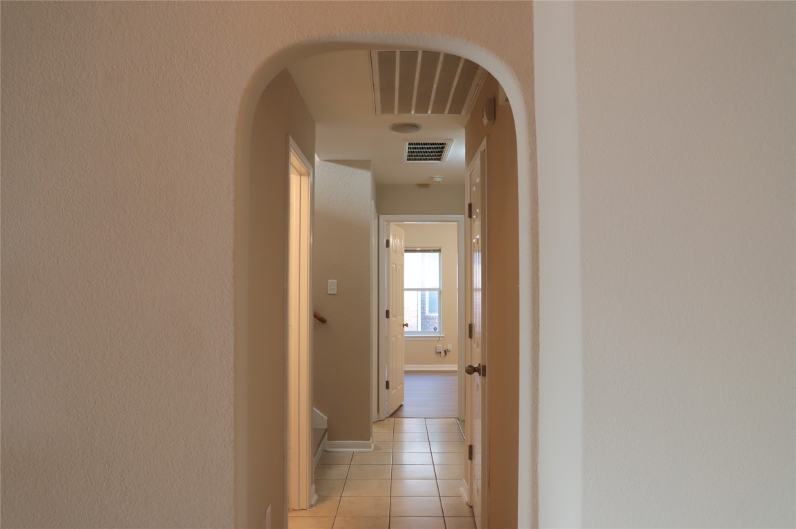 3936 Links Lane Round Rock, TX 78664 - Photo 26 of 40 a view of a bathroom from a hallway