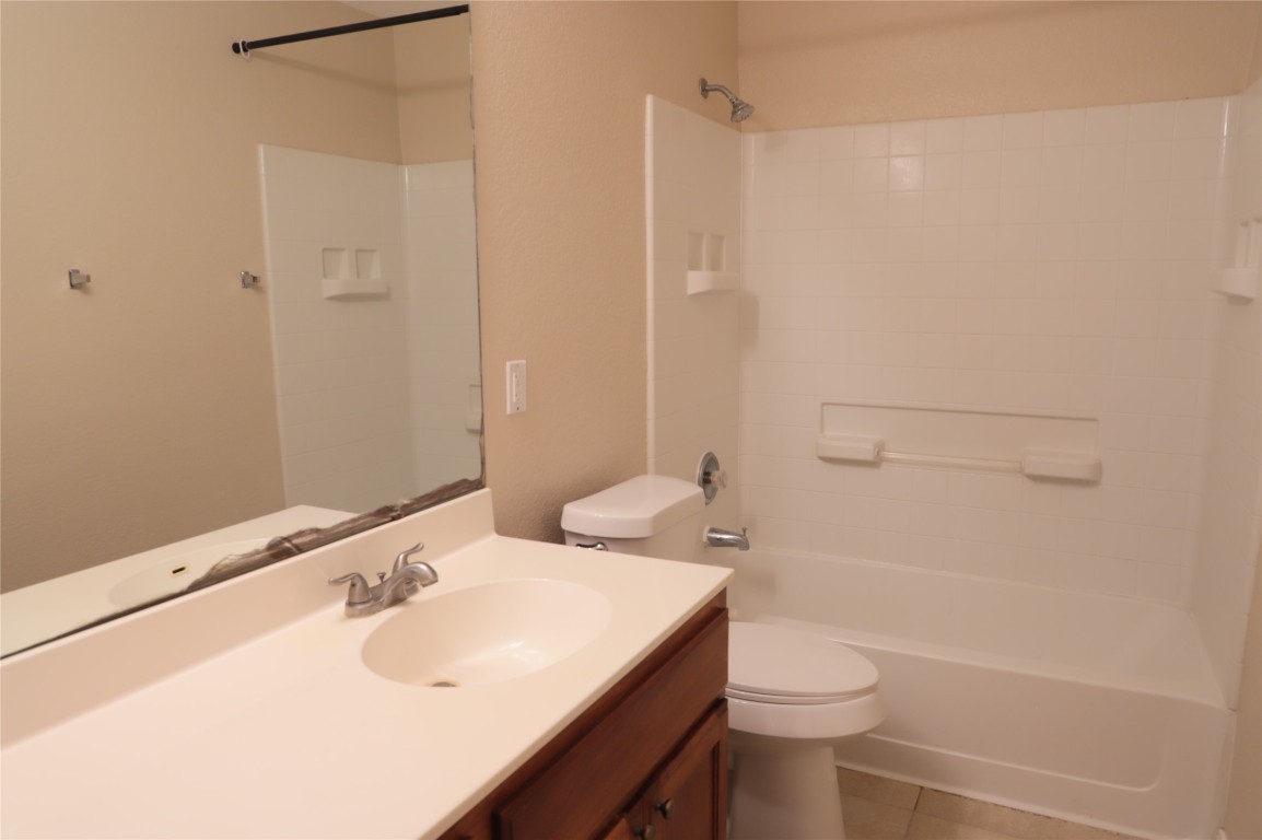 3936 Links Lane Round Rock, TX 78664 - Photo 27 of 40 a bathroom with a sink toilet and shower