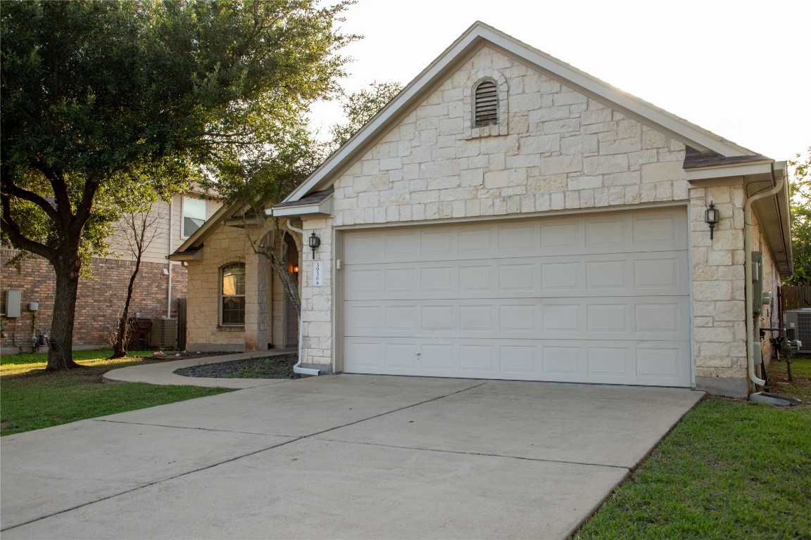 3936 Links Lane Round Rock, TX 78664 - Photo 3 of 40 a front view of house with yard and trees