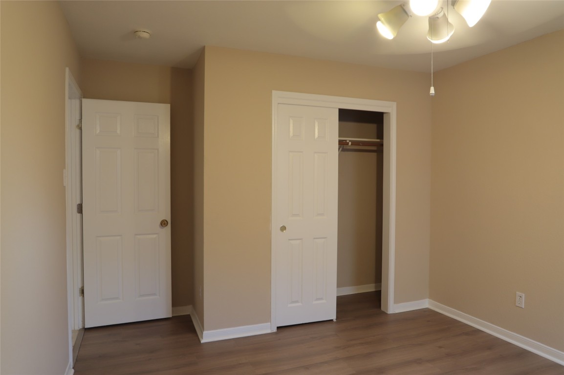 3936 Links Lane Round Rock, TX 78664 - Photo 29 of 40 an empty room with wooden floor and closet area
