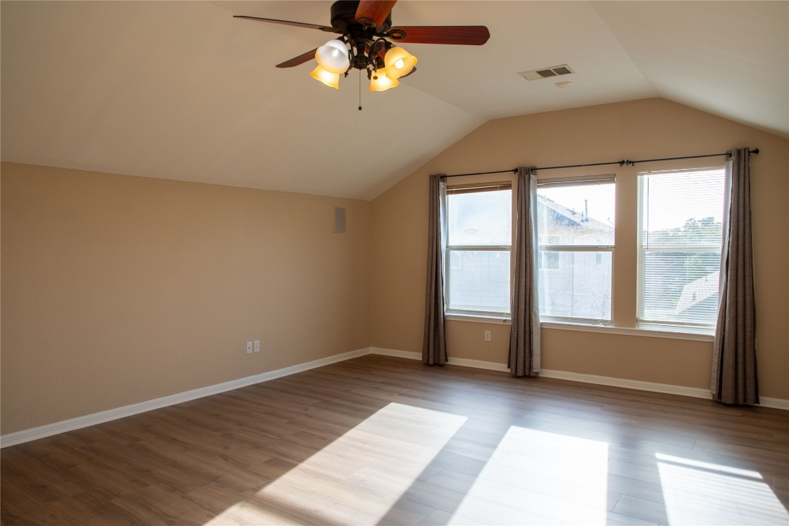 3936 Links Lane Round Rock, TX 78664 - Photo 33 of 40 wooden floor in an empty room with a window