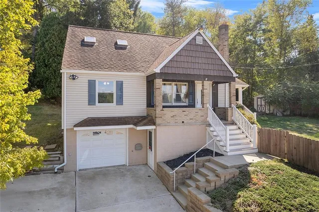 a aerial view of a house with backyard