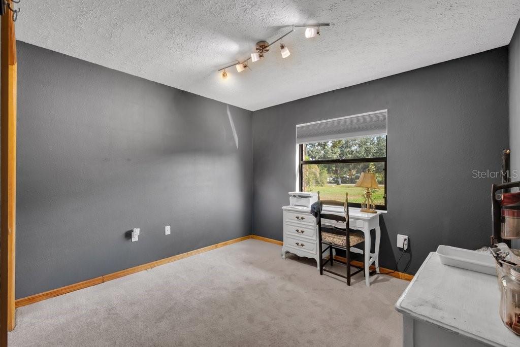 5301 Coronet Road Plant City, FL 33566 - Photo 14 of 38 a workspace with furniture and a window