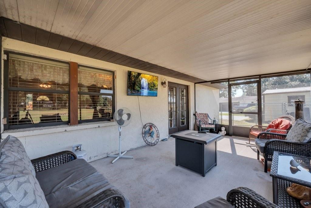 5301 Coronet Road Plant City, FL 33566 - Photo 30 of 38 a room with furniture gym equipment and large windows