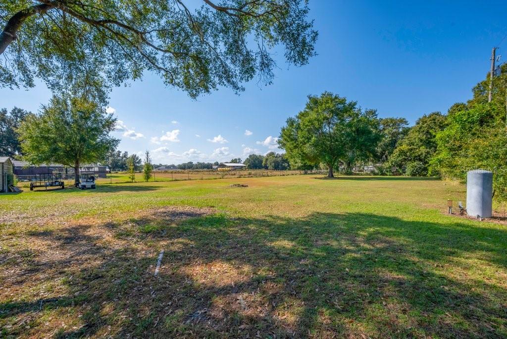 5301 Coronet Road Plant City, FL 33566 - Photo 32 of 38 a view of a golf course with a lake