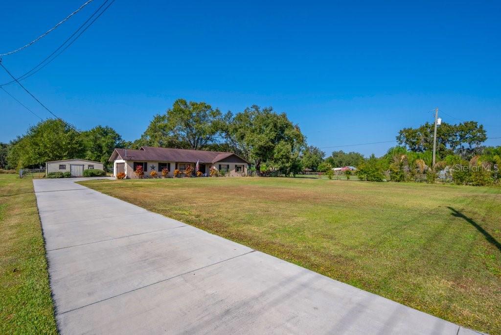 5301 Coronet Road Plant City, FL 33566 - Photo 36 of 38 a view of an outdoor space and swimming pool