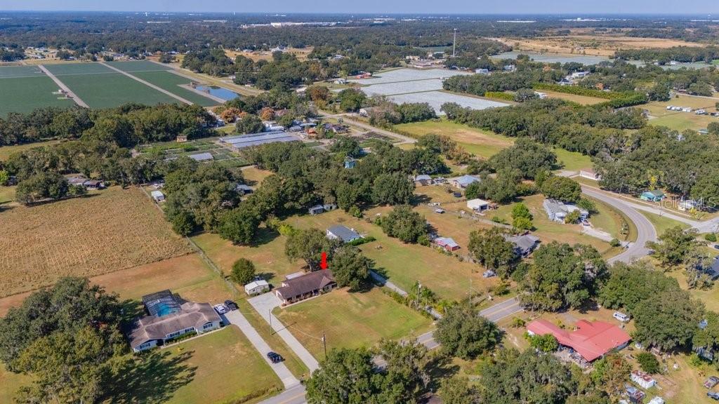 5301 Coronet Road Plant City, FL 33566 - Photo 5 of 38 an aerial view of a houses with a yard