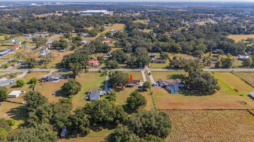 5301 Coronet Road Plant City, FL 33566 - Photo 8 of 38 an aerial view of a houses with a lake view