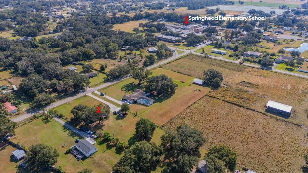 5301 Coronet Road Plant City, FL 33566 - Photo 9 of 38 an aerial view of residential houses with outdoor space