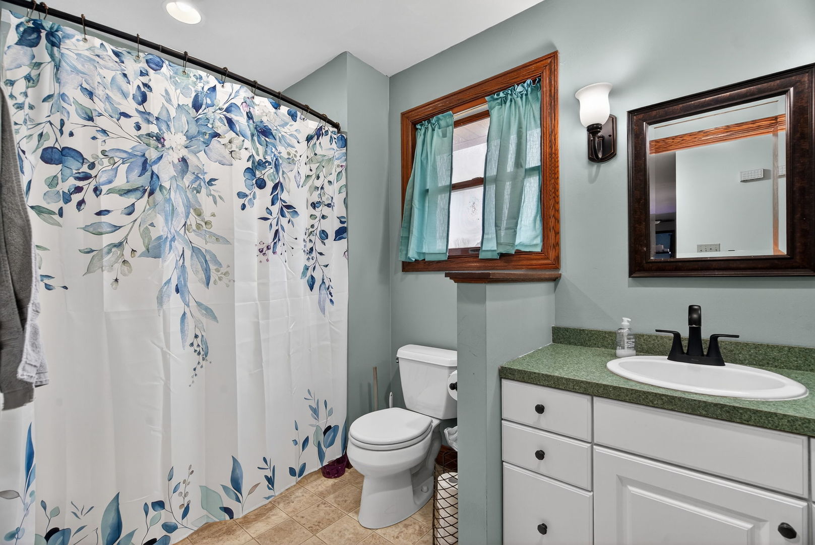 1707 North 2479th Road Ottawa, IL 61350 - Photo 12 of 30 a bathroom with a granite countertop sink a toilet and a mirror