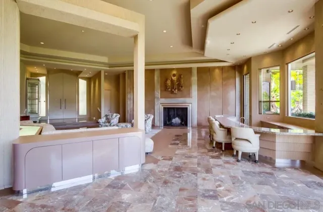 a large bathroom with a sink a large mirror and a shower