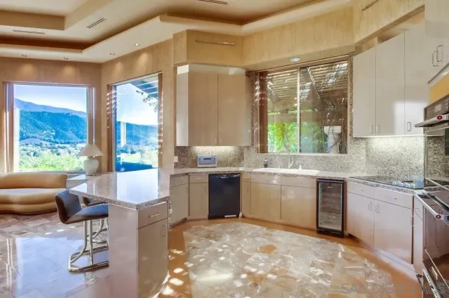 a view of a dining room with furniture wooden floor and chandelier
