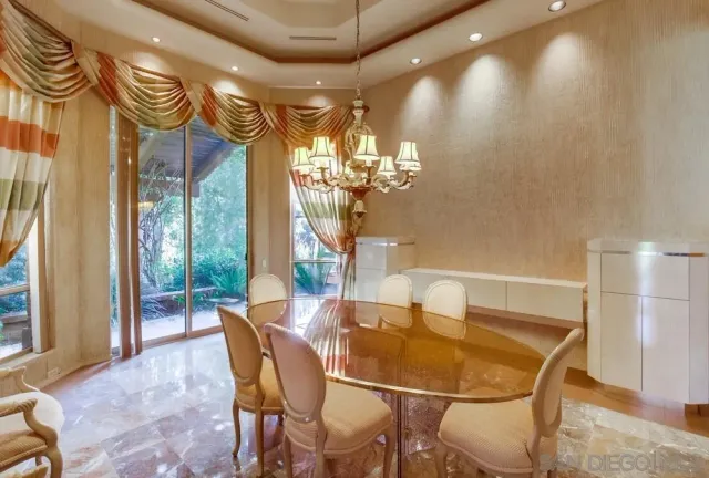 a dining room with furniture and window