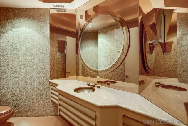 a spacious bedroom with a bed and a couch