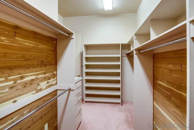 a white toilet sitting next to a small bathroom