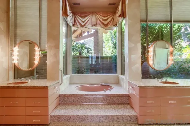 a bedroom with a bed and a cabinets