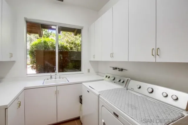 a kitchen with counter top space cabinets and stainless steel appliances