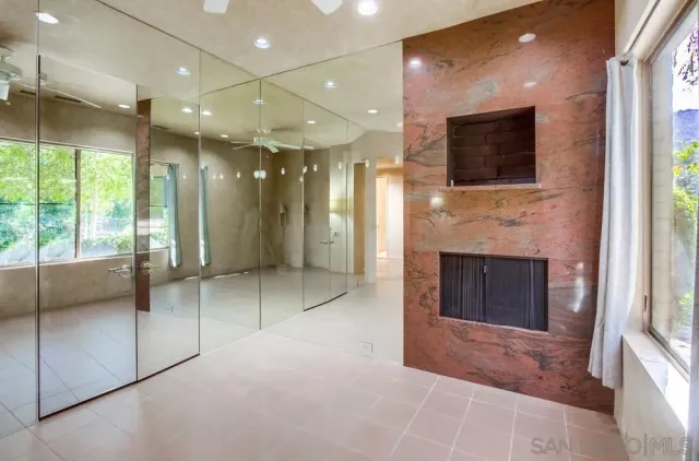 a view of a city with lush green forest