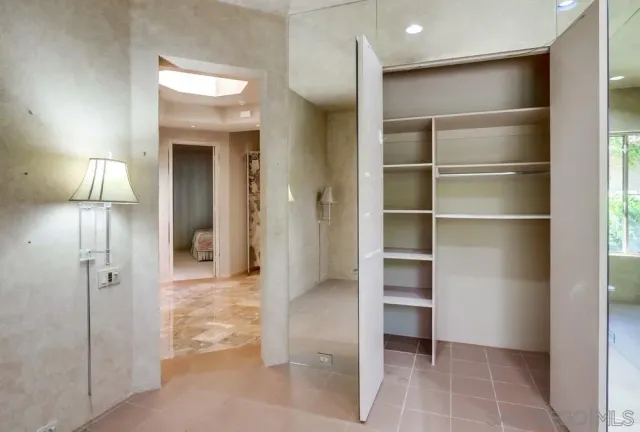 a view of a garden with a building in the background